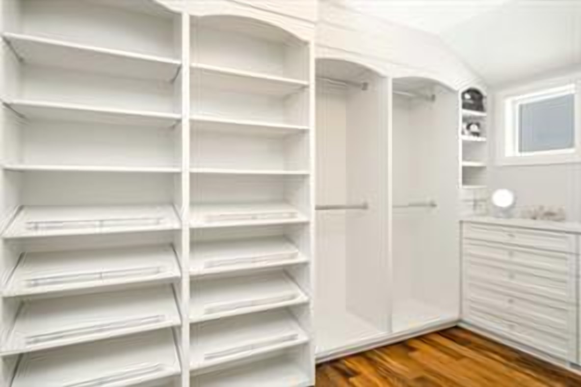 Fully fitted primary walk-in closet